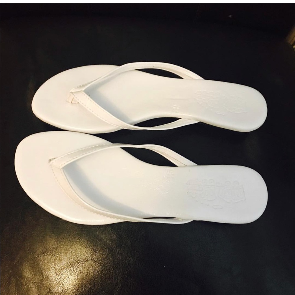 White patent leather sandals.